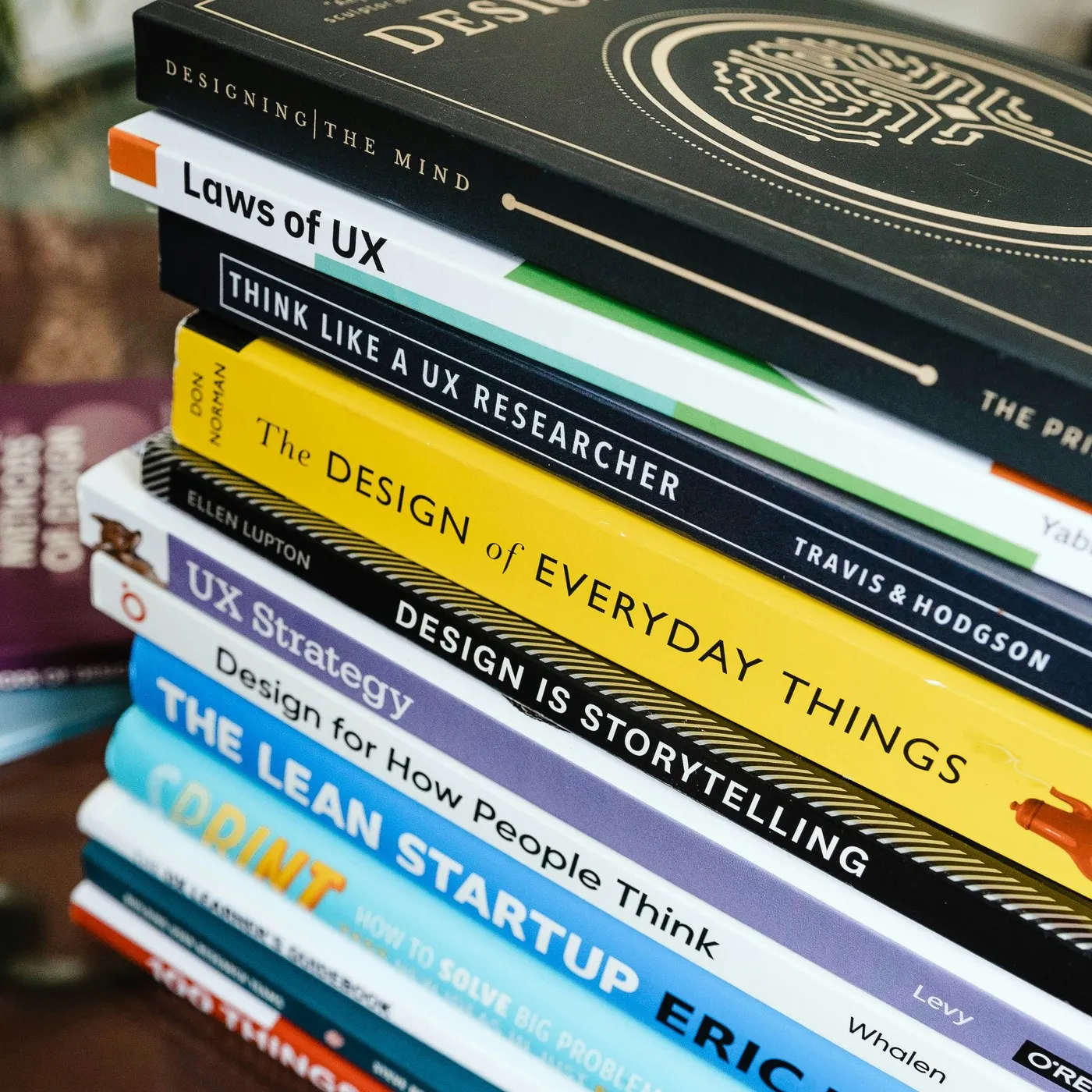 A stack of design and UX research books